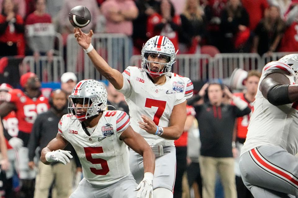 Dec 31, 2022; Atlanta, Georgia, USA; Ohio State Buckeyes quarterback C.J. Stroud (7) throws a pass during the second half of the Peach Bowl in the College Football Playoff semifinal at Mercedes-Benz Stadium. Ohio State lost 42-41. Mandatory Credit: Adam Cairns-The Columbus Dispatch