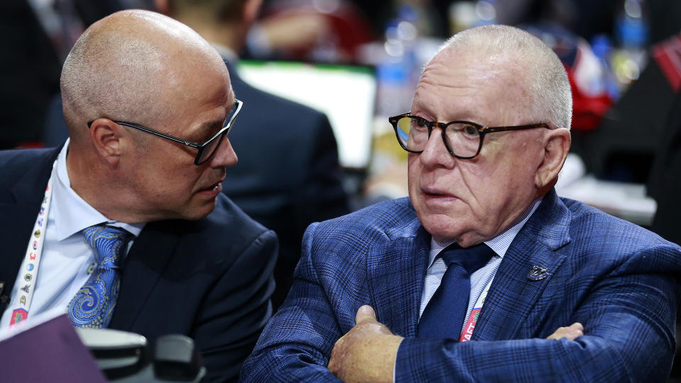 Jim Rutherford, right, has some regrets about how the Canucks handled the Bruce Boudreau situation. (Photo by Jeff Vinnick/NHLI via Getty Images)