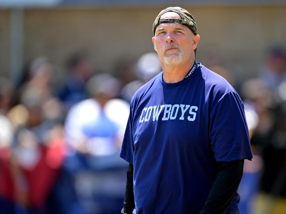 Dallas Cowboys defensive coordinator Dan Quinn runs drills during training camp at River Ridge Fields in Oxnard, CA.