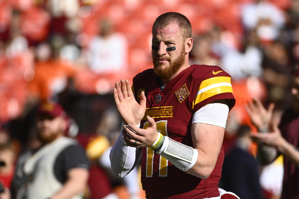 Jan 1, 2023; Landover, Maryland, USA; Washington Commanders quarterback Carson Wentz (11) before the game against the Cleveland Browns at FedExField. Mandatory Credit: Brad Mills-USA TODAY Sports