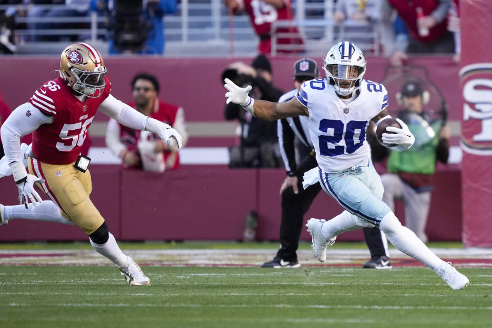 SANTA CLARA, CALIFORNIA - JANUARY 22: Tony Pollard #20 of the Dallas Cowboys carries the ball against the San Francisco 49ers during the first quarter in the NFC Divisional Playoff game at Levi's Stadium on January 22, 2023 in Santa Clara, California. (Photo by Thearon W. Henderson/Getty Images)