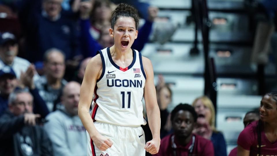 Dec 18, 2022; Uncasville, Connecticut, USA; UConn Huskies forward Lou Lopez-Senechal (11) reacts after her three point basket against the Florida State Seminoles in the first half at Mohegan Sun Arena.