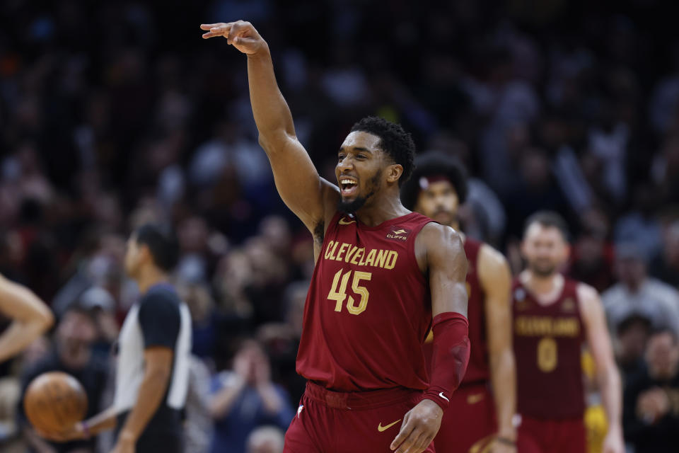 Cleveland Cavaliers guard Donovan Mitchell (45) celebrates after making a basket during the overtime of an NBA basketball game against the Chicago Bulls, Monday, Jan. 2, 2023, in Cleveland. (AP Photo/Ron Schwane)