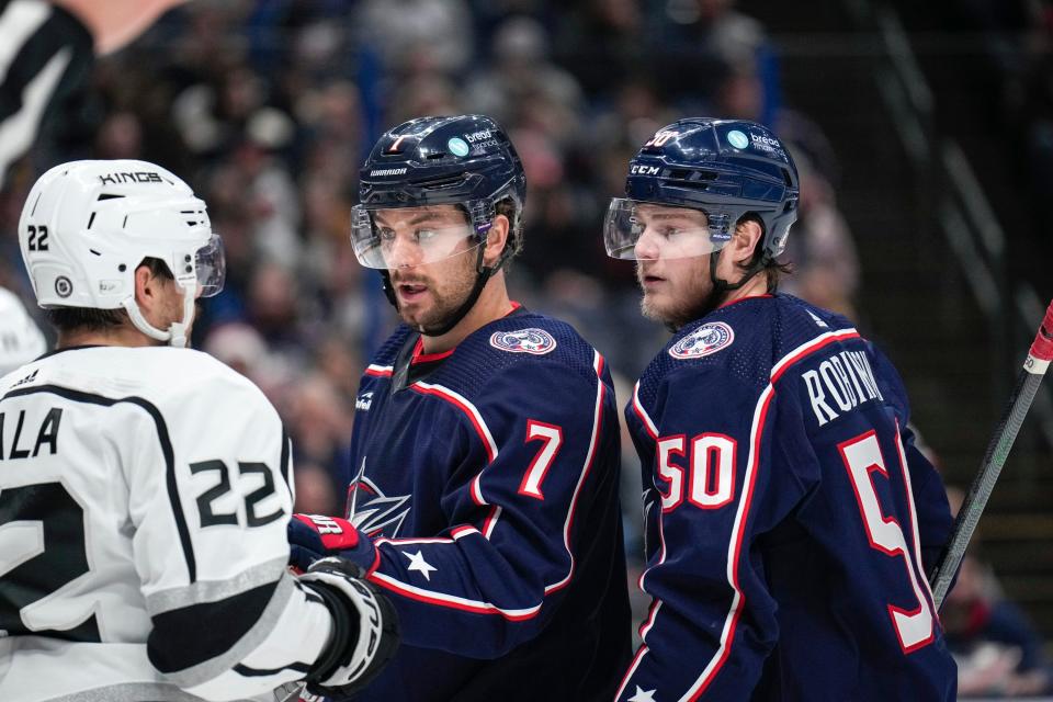 Dec 11, 2022; Columbus, Ohio, United States; Columbus Blue Jackets center Sean Kuraly (7) pushes Los Angeles Kings left wing Kevin Fiala (22) back while left wing Eric Robinson (50) watches during the second period of the NHL hockey game between the Columbus Blue Jackets and the Los Angeles Kings at Nationwide Arena. Mandatory Credit: Joseph Scheller-The Columbus Dispatch