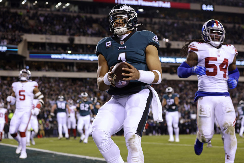 Philadelphia Eagles quarterback Jalen Hurts (1) reacts after scoring a touchdown against the New York Giants during an NFL divisional round playoff football game, Saturday, Jan. 21, 2023, in Philadelphia. (AP Photo/Rich Schultz)