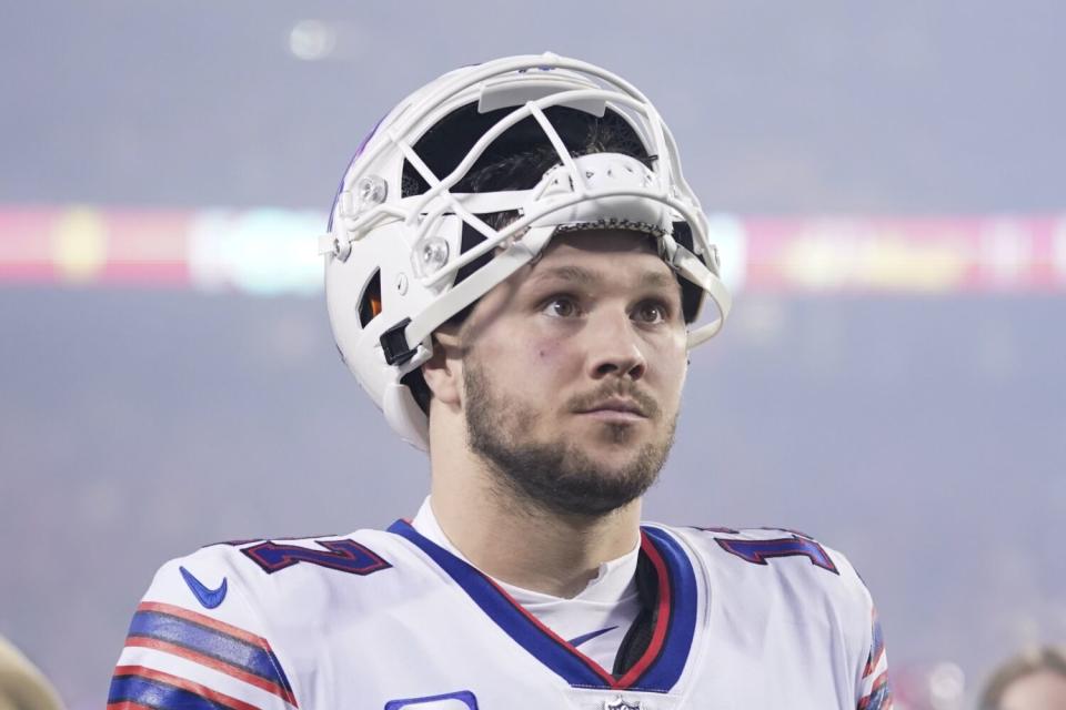 Buffalo Bills quarterback Josh Allen walks off the field after an overtime loss to the Kansas City Chiefs.