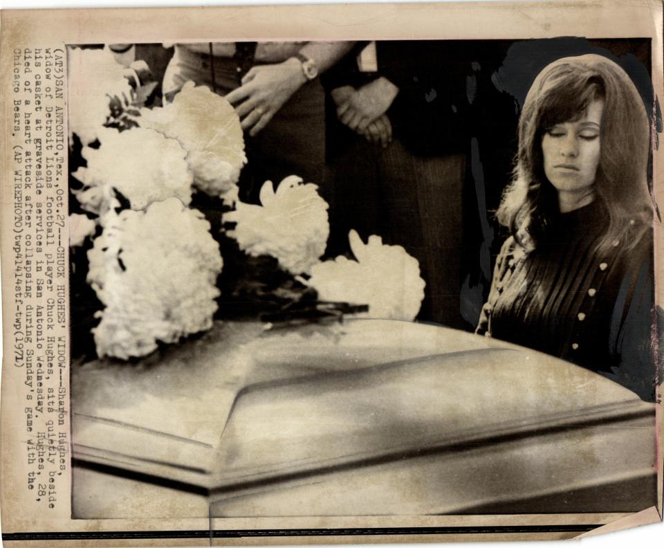 A newspaper clipping shows Sharon Hughes, widow of Detroit Lions football player Chuck Hughes, sitting beside his casket at graveside services Wednesday, Oct. 27, 1971 in San Antonio, Texas. Hughes, 28, died of a heart attack after collapsing during that Sunday’s game with the Chicago Bears. Hughes was buried in Texas.