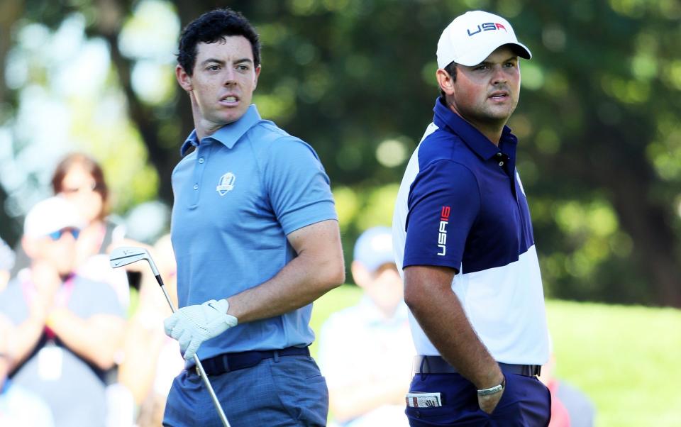 Rory McIlroy of Europe and Patrick Reed of the United States look on from the fourth tee during singles matches of the 2016 Ryder Cup at Hazeltine - Rory McIlroy: Yes I ignored Patrick Reed – because he subpoenaed me on Christmas Eve - Andrew Redington/Getty Images