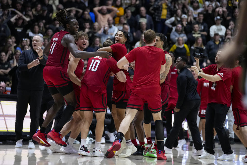 Rutgers players celebrate after beating Purdue