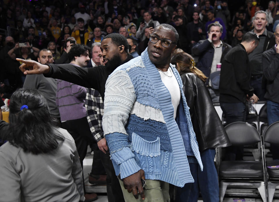 LOS ANGELES, CA - JANUARY 20: Shannon Sharpe is restrained by security after verbal altercation with Tee Morant, father of Ja Morant #12 of the Memphis Grizzlies, during the halftime against the Los Angeles Lakers at Crypto.com Arena on January 20, 2023 in Los Angeles, California. NOTE TO USER: User expressly acknowledges and agrees that, by downloading and or using this photograph, User is consenting to the terms and conditions of the Getty Images License Agreement. (Photo by Kevork Djansezian/Getty Images)