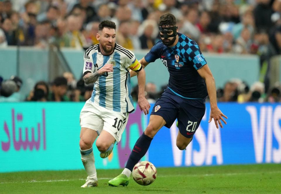 Lionel Messi dribbles away from Croatian defender Josko Gvardiol (PA)