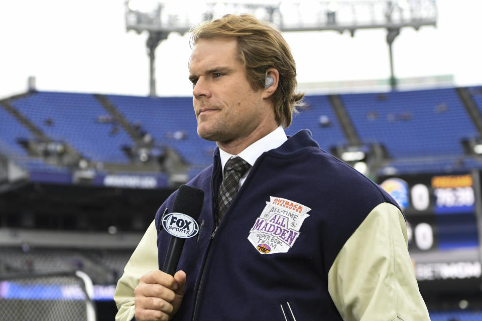 Fox Sports broadcaster Greg Olsen wears and All Madden varsity jacket in honor of John Madden who recently passed away before an NFL football game between the Baltimore Ravens and the Los Angeles Rams, Sunday, Jan. 2, 2022, in Baltimore. (AP Photo/Terrance Williams)