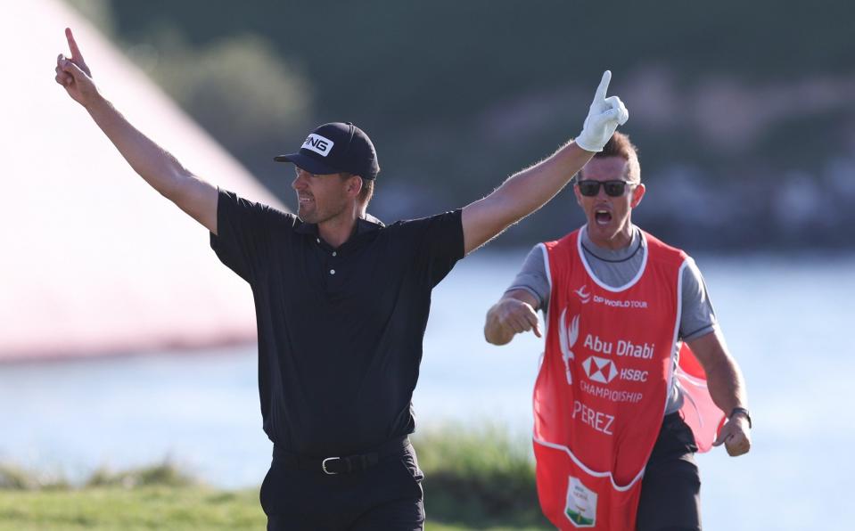 Victor Perez of France and his caddie James Erkenbeck celebrate after a birdie on the seventeenth hole - Getty Images/Oisin Keniry