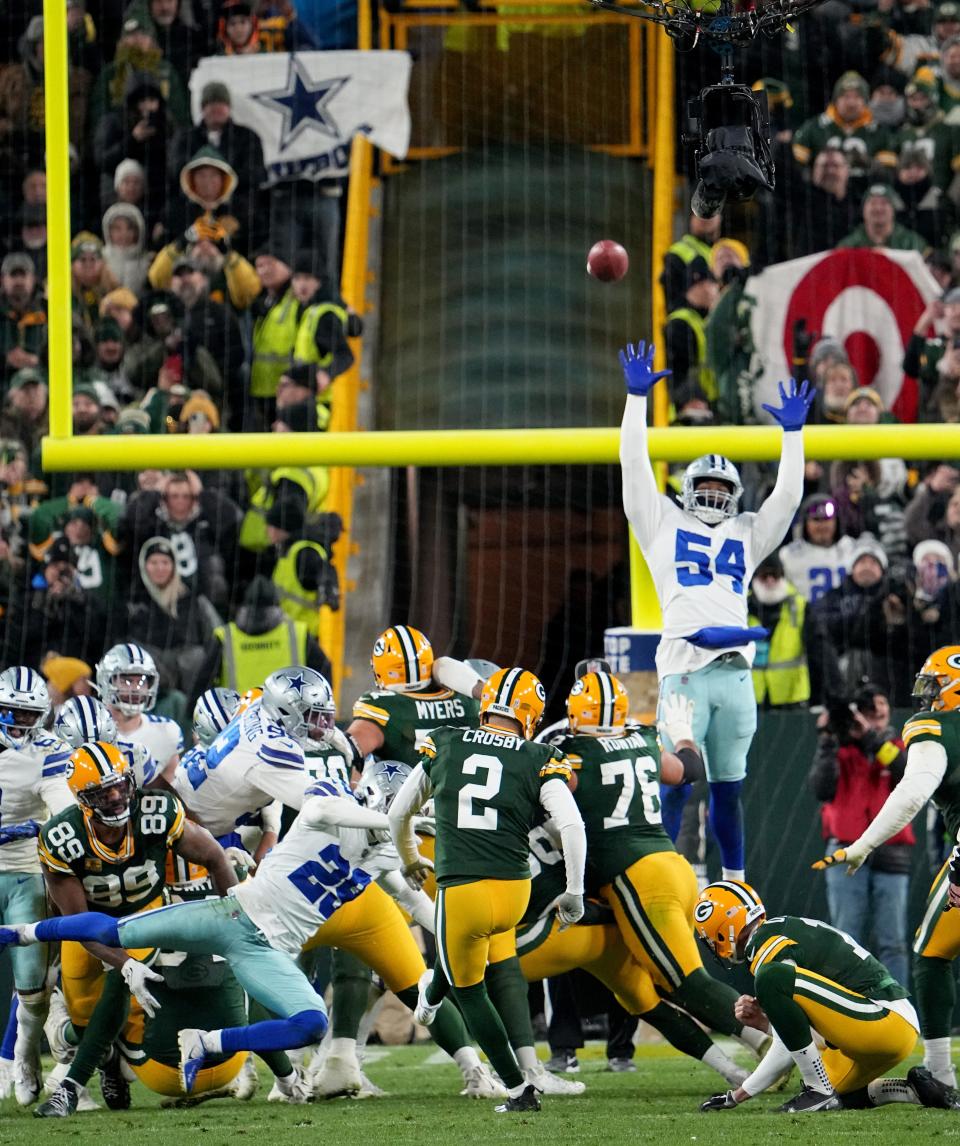 Green Bay's Mason Crosby kicks the game-winning field goal during overtime against the Dallas Cowboys.