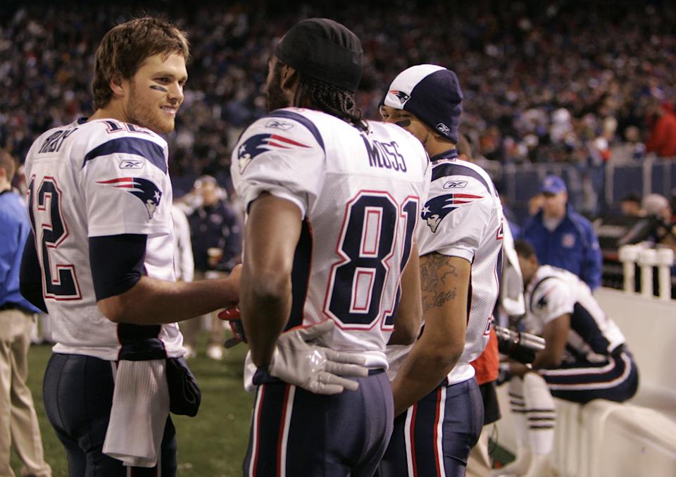 Tom Brady and Randy Moss had plenty to celebrate during their historic 2007 season. (Photo by Rob Tringali/Sportschrome/Getty Images)