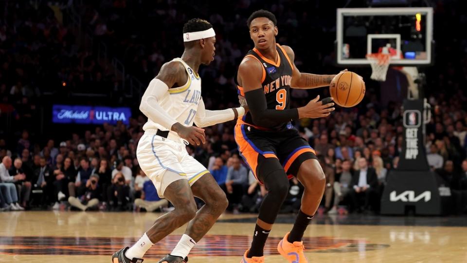 Jan 31, 2023; New York, New York, USA; New York Knicks guard RJ Barrett (9) brings the ball up court against Los Angeles Lakers guard Dennis Schroder (17) during the first quarter at Madison Square Garden.