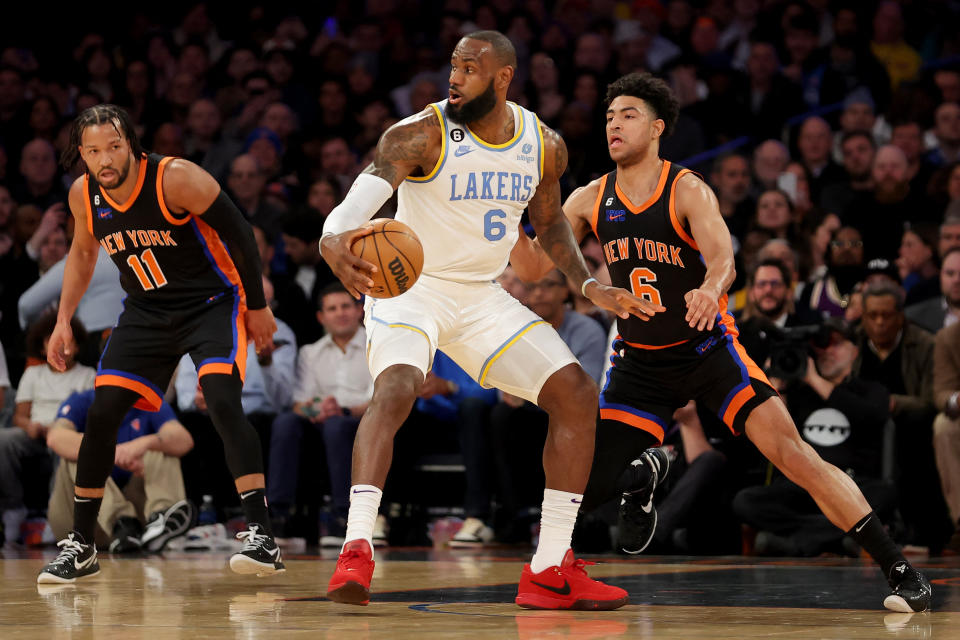 Jan 31, 2023; New York, New York, USA; Los Angeles Lakers forward LeBron James (6) controls the ball against New York Knicks guards Quentin Grimes (6) and Jalen Brunson (11) during the first quarter at Madison Square Garden. Mandatory Credit: Brad Penner-USA TODAY Sports