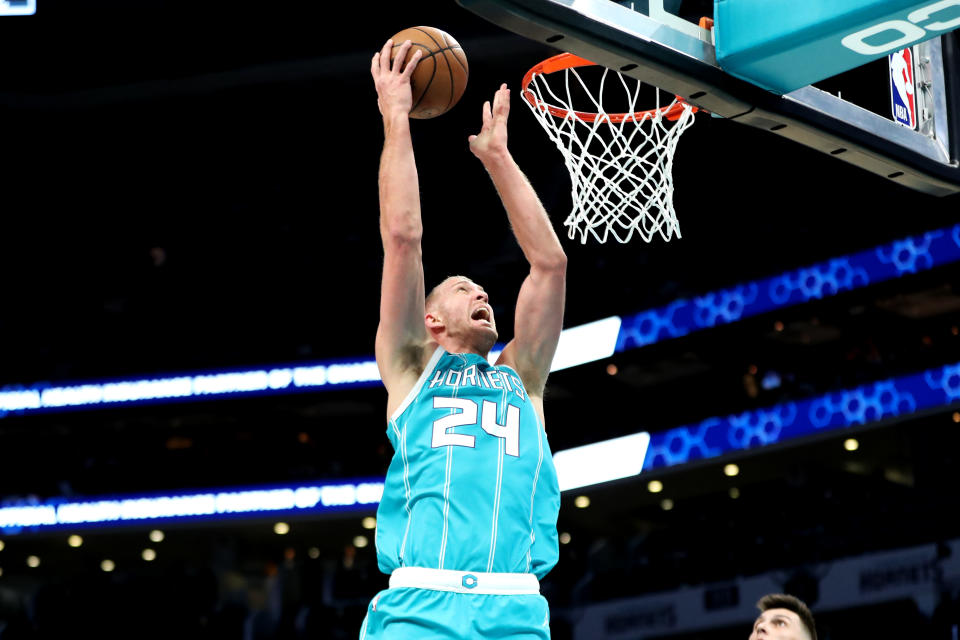 Mason Plumlee #24 of the Charlotte Hornets lays the ball up during the first quarter of an NBA game against the Miami Heat 