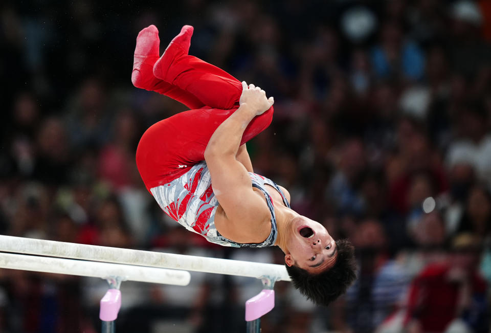 USA's Asher Hong performs on the Parallel Bars during the men's team final at the Paris Olympics. (Mike Egerton/PA Images via Getty Images)