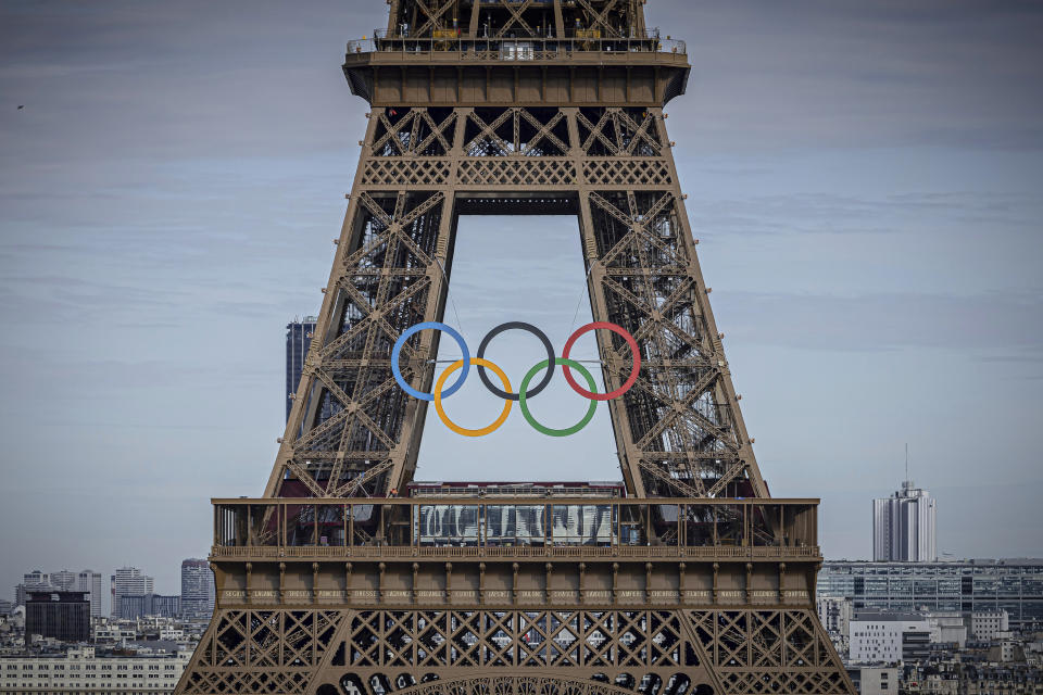 The Olympic rings are seen on the Eiffel Tower, Sunday, July 14, 2024, in Paris. (AP Photo/Aurelien Morissard)