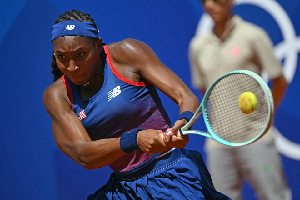 US' Coco Gauff returns to Argentina's Maria Lourdes Carle during their women's singles second round tennis match on Court Suzanne-Lenglen at the Roland-Garros Stadium at the Paris 2024 Olympic Games, in Paris on July 29, 2024. (Photo by Miguel MEDINA / AFP) (Photo by MIGUEL MEDINA/AFP via Getty Images)