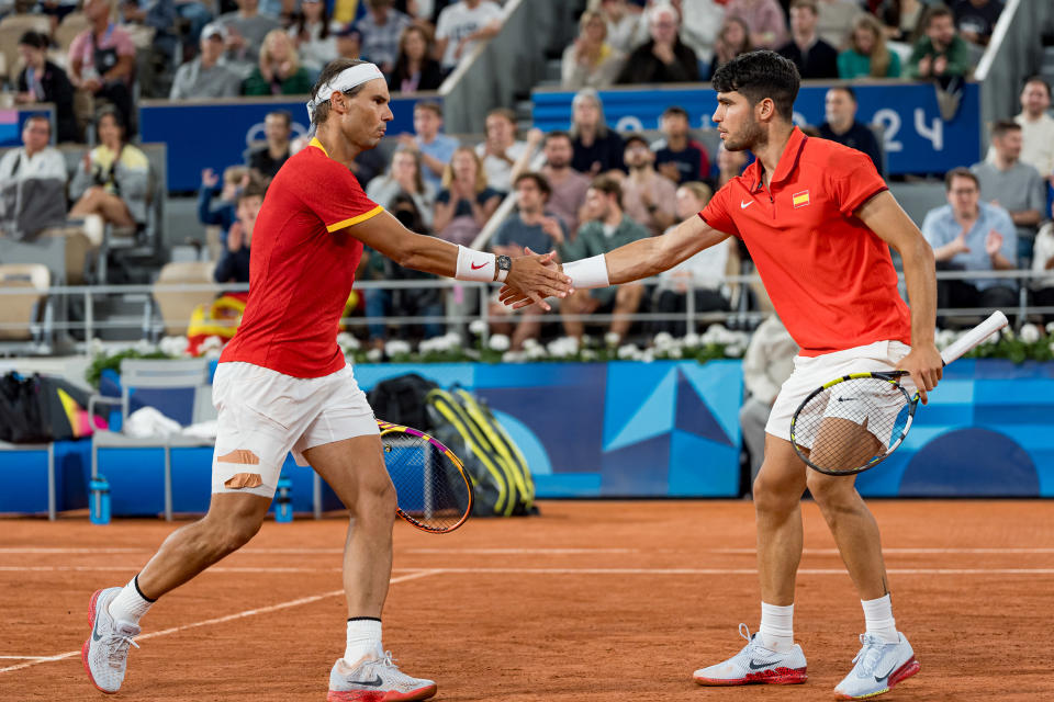 PARIS, FRANCE - JULY 27: Rafael Nadal (L) and partner Carlos Alcaraz of Team Spain celebrates a point against Andres Molteni and Maximo Gonzalez of Team Argentina during the Men's Doubles first round match on day one of the Olympic Games Paris 2024 at Roland Garros on July 27, 2024 in Paris, France. (Photo by Andy Cheung/Getty Images)