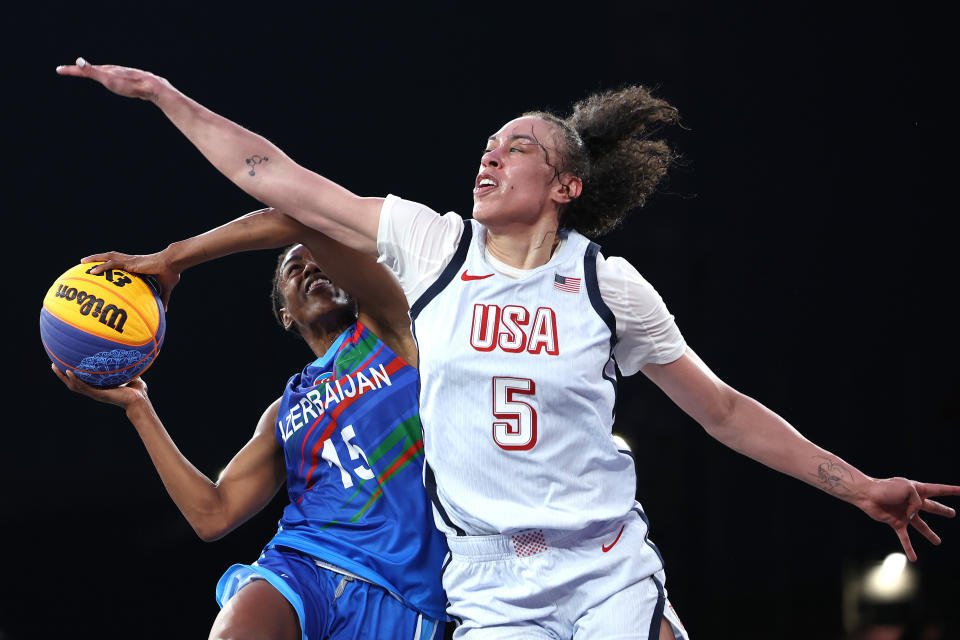 PARIS, FRANCE - JULY 31: Tiffany Hayes #15 of Team Azerbaijan attempts to shoot over Dearica Hamby #5 of Team United States during a Women's Pool Round match between Azerbaijan and United States on day five of the Olympic Games Paris 2024 at Esplanade Des Invalides on July 31, 2024 in Paris, France. (Photo by Ezra Shaw/Getty Images)