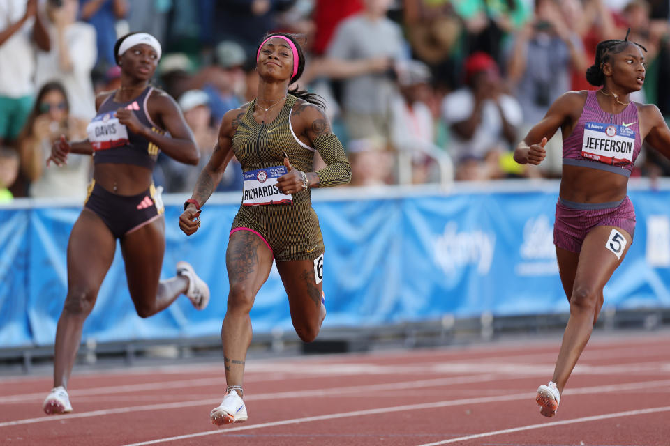 EUGENE, OREGON - JUNE 22: Sha'Carri Richardson and Melissa Jefferson cross the finish line of the women's 100 meter final on Day Two of the 2024 U.S. Olympic Team Track & Field Trials at Hayward Field on June 22, 2024 in Eugene, Oregon. (Photo by Christian Petersen/Getty Images)