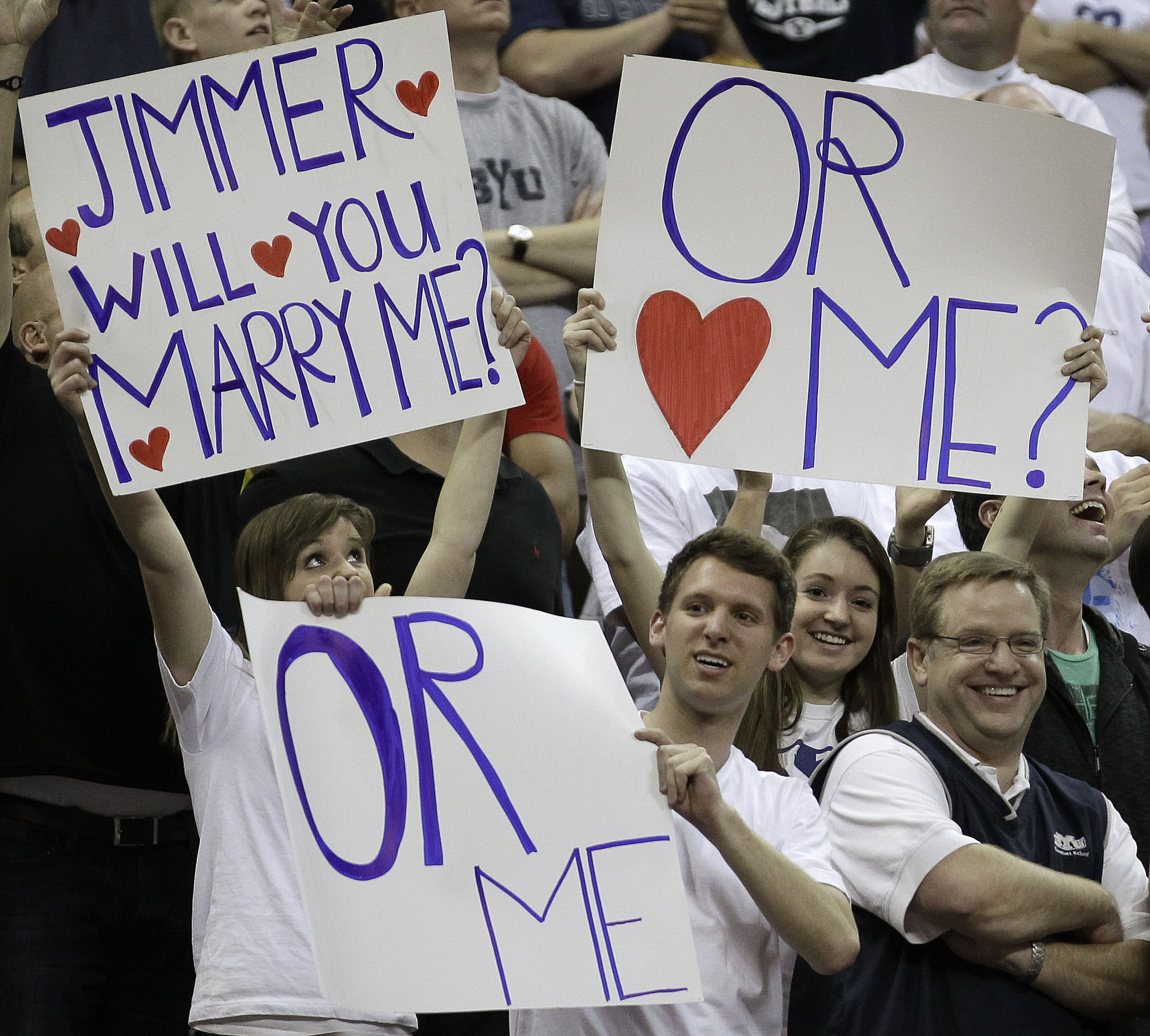 BYU fans hold up signs during the second half of an NCAA college basketball game against New Mexico in the semifinals of the Mountain West Conference tournament, Friday, March 11, 2011, in Las Vegas. Jimmer Fredette scored 52 points in BYU's 87-76 win. (AP Photo/Julie Jacobson)