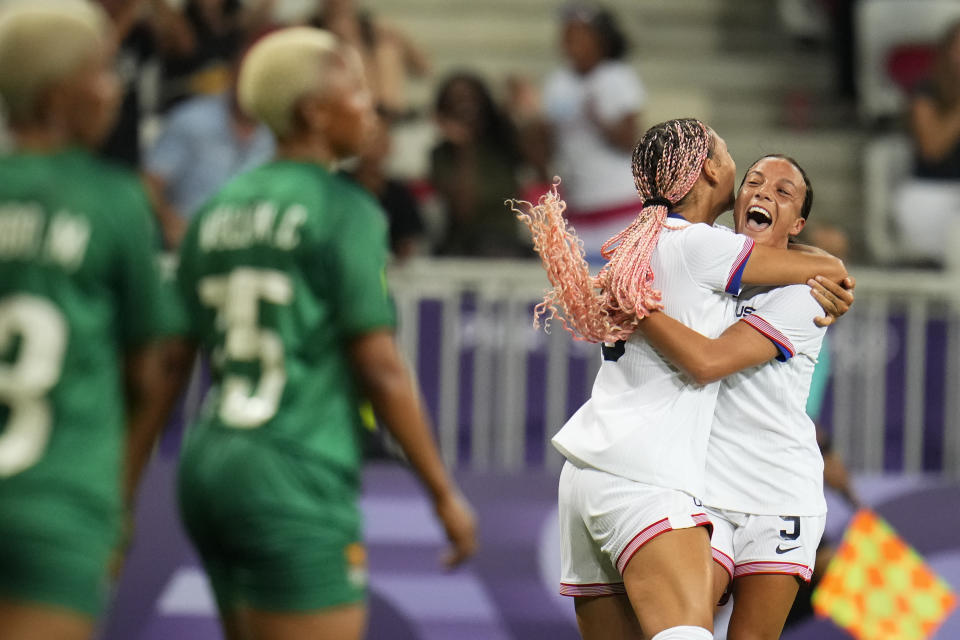 United States' Trinity Rodman, second from right, reacts with teammate Mallory Swanson after scoring the first goal against Zambia at Nice Stadium at the 2024 Summer Olympics. (AP Photo/Julio Cortez)