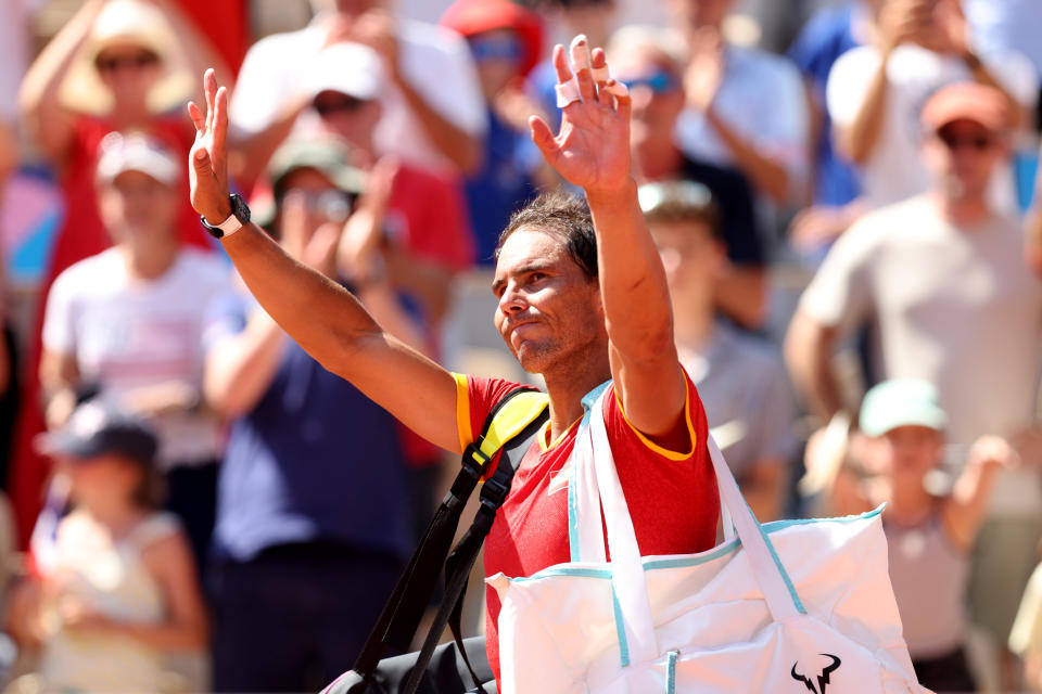 PARIS, FRANCE - JULY 29: Rafael Nadal of Team Spain acknowledges the crowd after losing to Novak Djokovic of Team Serbia at the end of their the Men's Singles second round match on day three of the Olympic Games Paris 2024 at Roland Garros on July 29, 2024 in Paris, France. (Photo by Clive Brunskill/Getty Images)