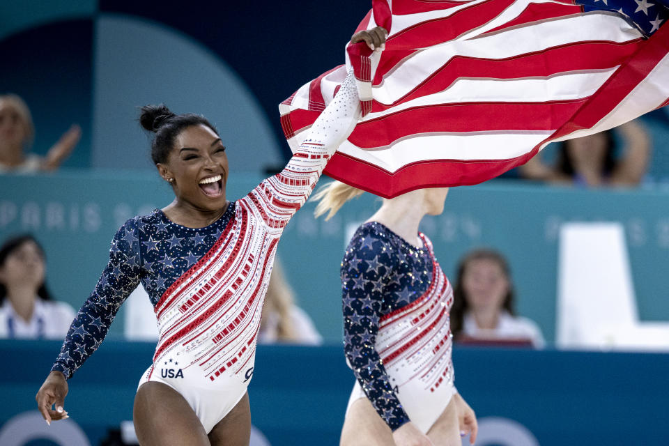 Simone Biles and her United States teammates celebrate after winning gold at the 2024 Olympic Games in Paris. (Aytac Unal/Anadolu via Getty Images)