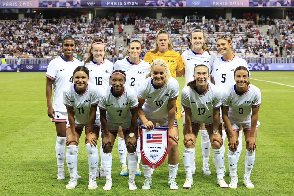 The Americans ahead of their 3-0 opening win over Zambia. (Valery Hache/AFP via Getty Images)