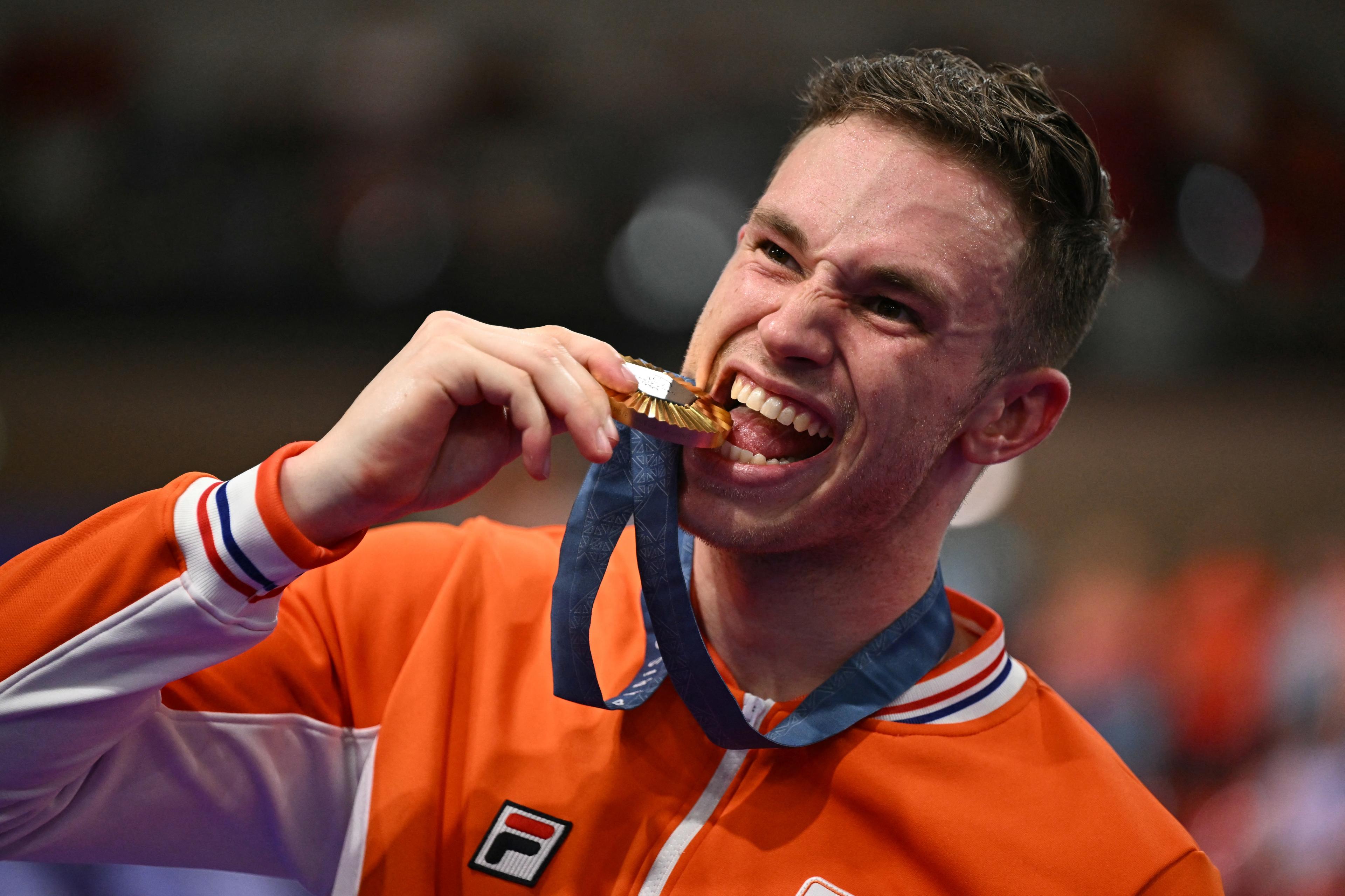 Gold medallist Netherlands' Harrie Lavreysen poses with his medal on the podium of the men's track cycling sprint event of the Paris 2024 Olympic Games at the Saint-Quentin-en-Yvelines National Velodrome in Montigny-le-Bretonneux, south-west of Paris, on August 9, 2024. (Sebastien Bozon/AFP/Getty Images)