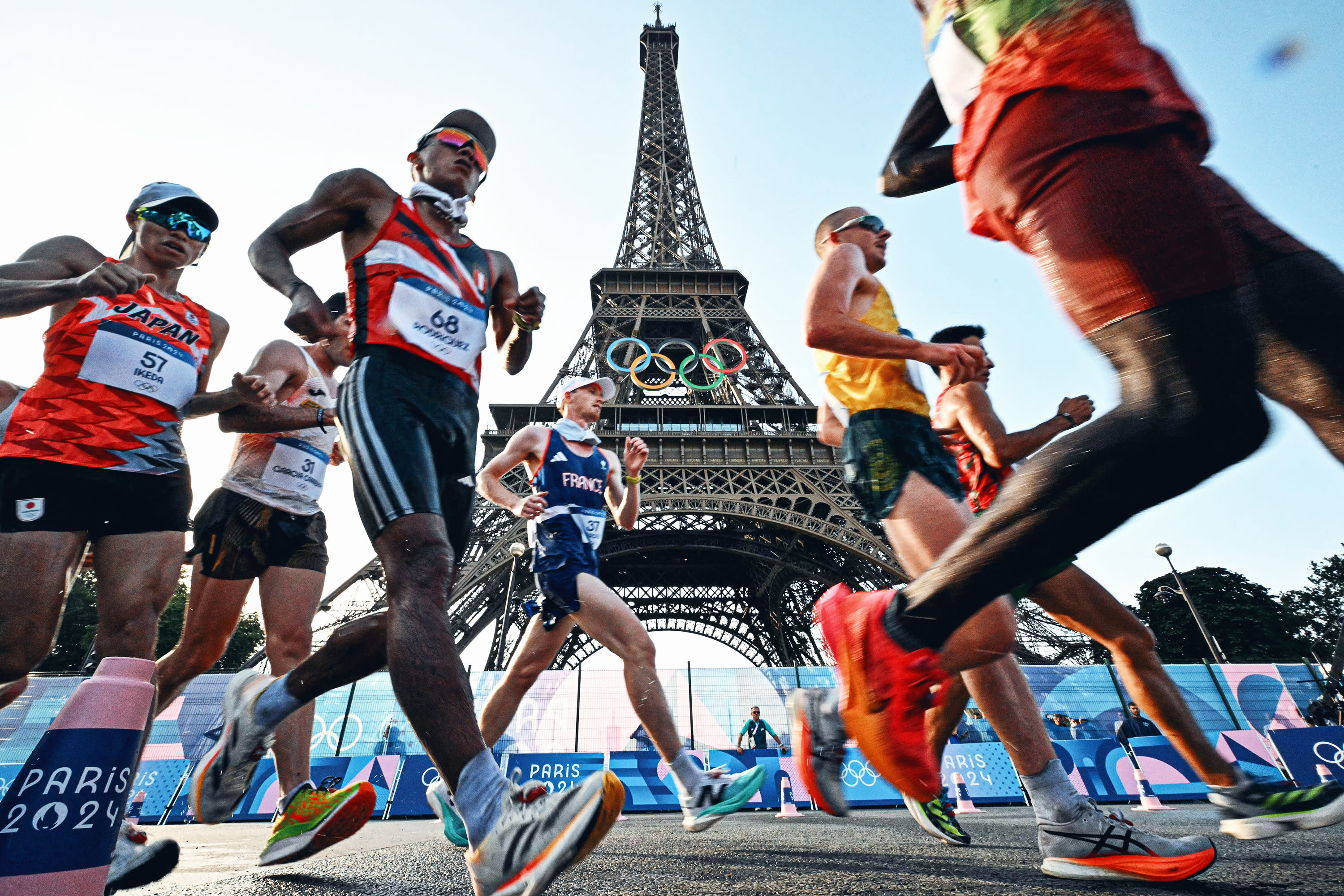 Athletes compete in the men's 20km race walk of the athletics event at the Paris 2024 Olympic Games at Trocadero in Paris on August 1, 2024. (Photo by LIONEL BONAVENTURE/AFP via Getty Images)