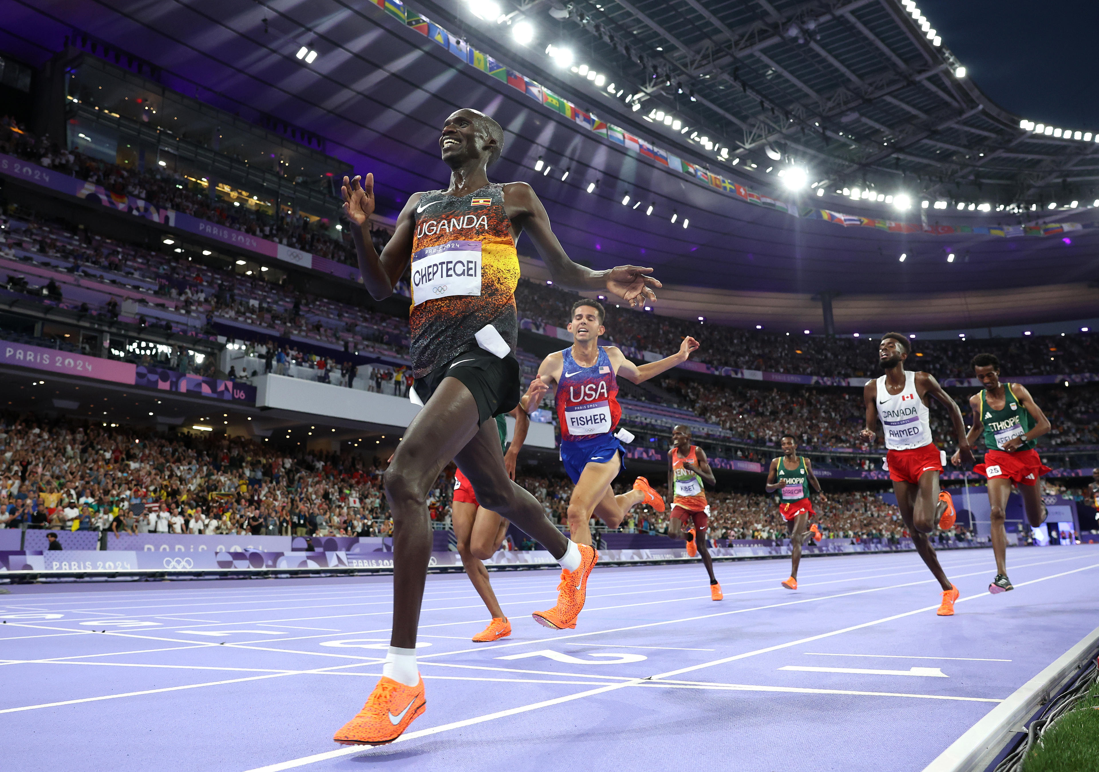 Joshua Cheptegei of Team Uganda celebrates winning the Men's 10,000m Final on day seven of the Olympic Games Paris 2024 at Stade de France on August 02, 2024 in Paris, France. (Cameron Spencer/Getty Images)