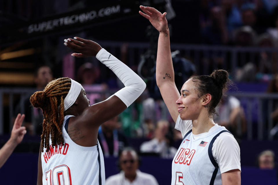 US' #05 Dearica Hamby (R) reacts as making the winning basket in the women's 3x3 basketball play-in games during the Paris 2024 Olympic Games at La Concorde in Paris on August 3, 2024. (Photo by David GRAY / AFP) (Photo by DAVID GRAY/AFP via Getty Images)