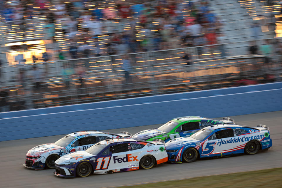 LEBANON, TENNESSEE - JUNE 30: Denny Hamlin, driver of the #11 FedEx Toyota, Ross Chastain, driver of the #1 Busch Country Chevrolet, Kyle Larson, driver of the #5 HendrickCars.com Chevrolet, and Kyle Busch, driver of the #8 zone/Thorntons Chevrolet, race during the NASCAR Cup Series Ally 400 at Nashville Superspeedway on June 30, 2024 in Lebanon, Tennessee. (Photo by James Gilbert/Getty Images)