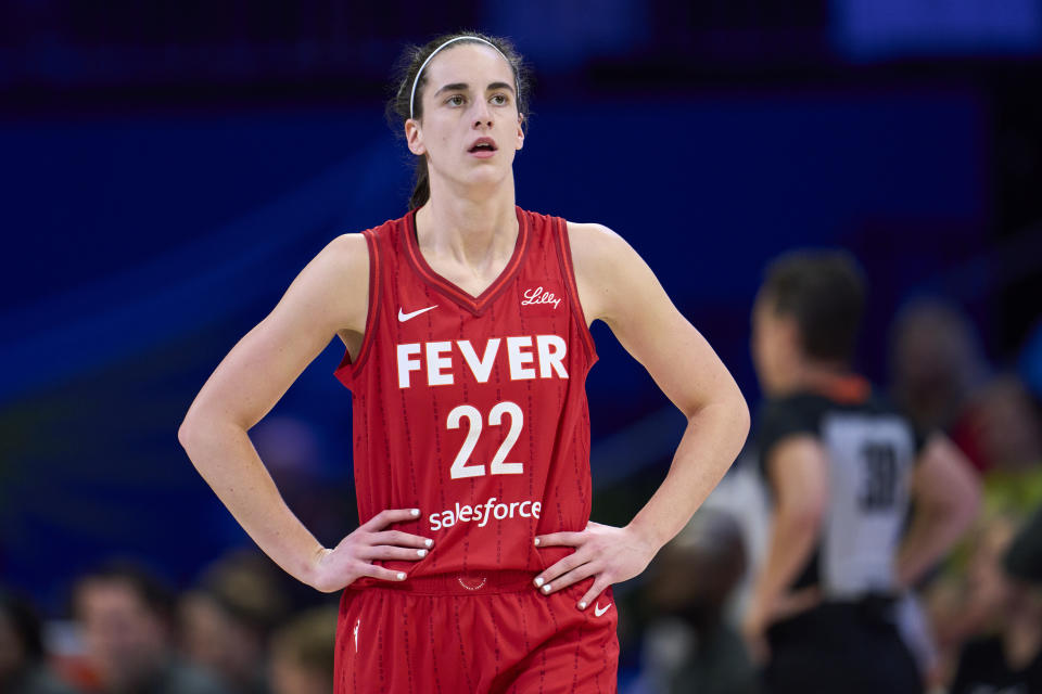 ARLINGTON, TEXAS - JULY 17: Caitlin Clark #22 of the Indiana Fever looks on against the Dallas Wings at the College Park Center on July 17, 2024 in Arlington, Texas. NOTE TO USER: User expressly acknowledges and agrees that, by downloading and or using this photograph, User is consenting to the terms and conditions of the Getty Images License Agreement. (Photo by Cooper Neill/Getty Images)