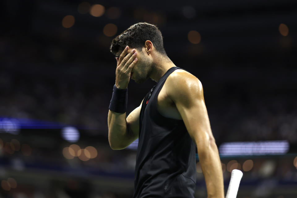 NEW YORK, NEW YORK - AUGUST 29: Carlos Alcaraz of Spain reacts after a point against Botic van De Zandschulp of the Netherlands during their Men's Singles Second Round match on Day Four of the 2024 US Open at USTA Billie Jean King National Tennis Center on August 29, 2024 in the Flushing neighborhood of the Queens borough of New York City. (Photo by Luke Hales/Getty Images)