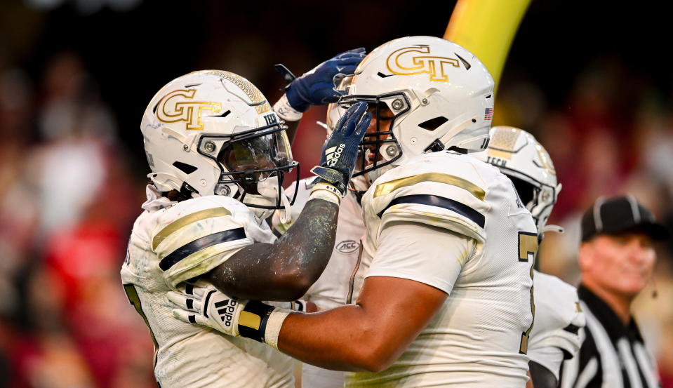 Georgia Tech Yellow Jackets running back Jamal Haynes celebrates with Jordan Brown after scoring a touchdown. (Brendan Moran/Sportsfile via Getty Images)