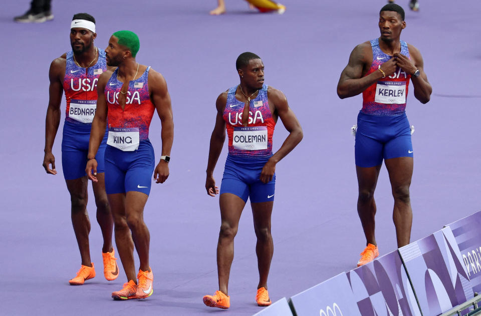 Paris 2024 Olympics - Athletics - Men's 4 x 100m Relay Final - Stade de France, Saint-Denis, France - August 09, 2024. Kenneth Bednarek of United States, Kyree King of United States, Christian Coleman of United States ad Fred Kerley of United States react after competing. REUTERS/Phil Noble