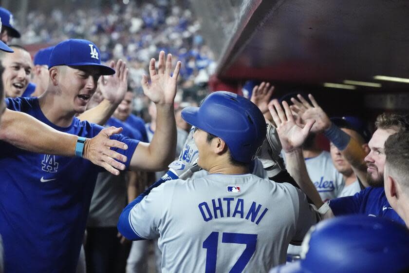 Los Angeles Dodgers designated hitter Shohei Ohtani, of Japan, celebrates his home run.