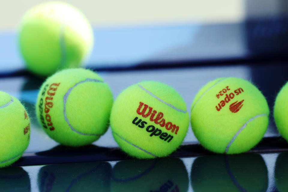 NEW YORK, NEW YORK - AUGUST 22: Detail of Wilson tennis balls with the US Open logo during a practice session prior to the start of the 2024 US Open at USTA Billie Jean King National Tennis Center on August 22, 2024 in the Flushing neighborhood of the Queens borough of New York City. (Photo by Sarah Stier/Getty Images)