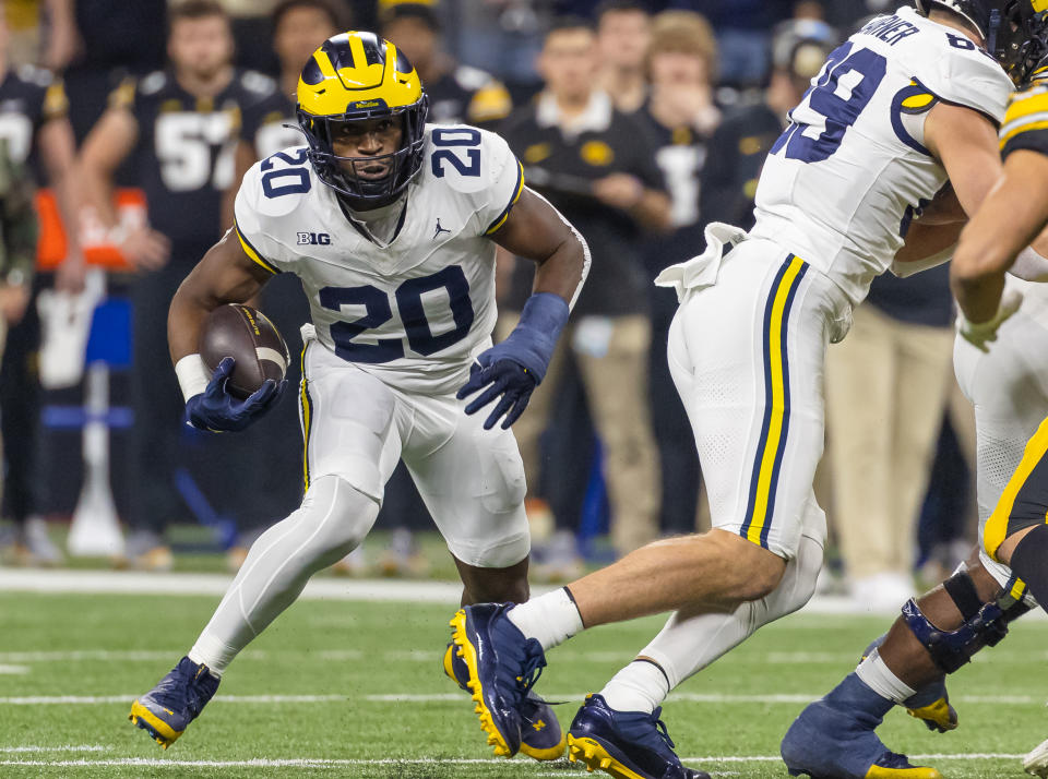 INDIANAPOLIS, INDIANA - DECEMBER 2: Kalel Mullings #20 of the Michigan Wolverines runs the ball against the Iowa Hawkeyes during the Big Ten Championship at Lucas Oil Stadium on December 2, 2023 in Indianapolis, Indiana. (Photo by Michael Hickey/Getty Images)