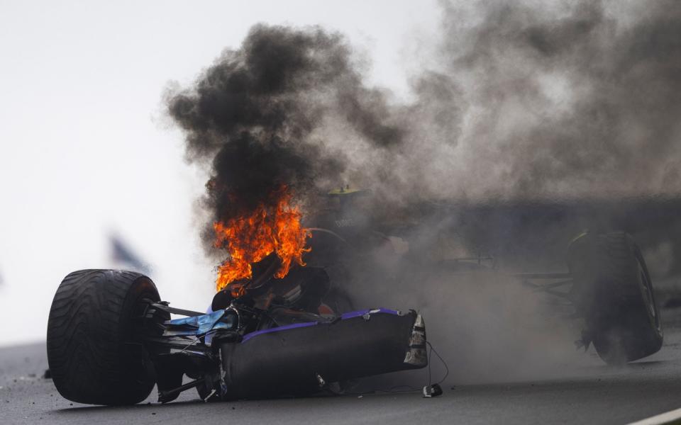 The car of Logan Sargeant of United States and Williams is seen on fire after crashing during final practice ahead of the F1 Grand Prix of Netherlands at Circuit Zandvoort on August 24, 2024 in Zandvoort, Netherlands