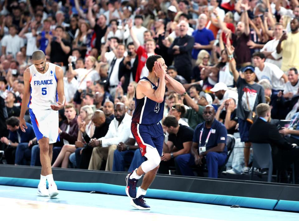 American Stephen Curry celebrates hitting a three pointer against France by mimicking going to sleep