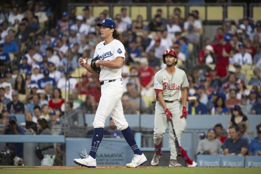 Los Angeles Dodgers pitcher Tyler Glasnow (31) walks back to the mound during the second inning of a baseball game against the Philadelphia Phillies in Los Angeles, Monday, Aug. 5, 2024. (AP Photo/Kyusung Gong)