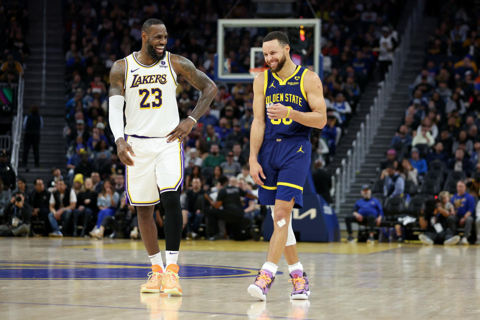 SAN FRANCISCO, CALIFORNIA - JANUARY 27: Stephen Curry #30 of the Golden State Warriors and LeBron James #23 of the Los Angeles Lakers joke around with one another during their game at Chase Center on January 27, 2024 in San Francisco, California. NOTE TO USER: User expressly acknowledges and agrees that, by downloading and or using this photograph, User is consenting to the terms and conditions of the Getty Images License Agreement. (Photo by Ezra Shaw/Getty Images)