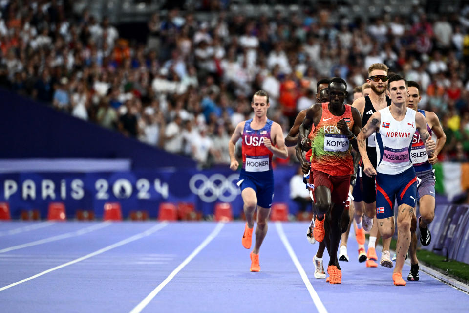 US' Cole Hocker, Kenya's Brian Komen and Norway's Jakob Ingebrigtsen compete in the men's 1500m final of the athletics event at the Paris 2024 Olympic Games at Stade de France in Saint-Denis, north of Paris, on August 6, 2024. (Photo by Jewel SAMAD / AFP) (Photo by JEWEL SAMAD/AFP via Getty Images)